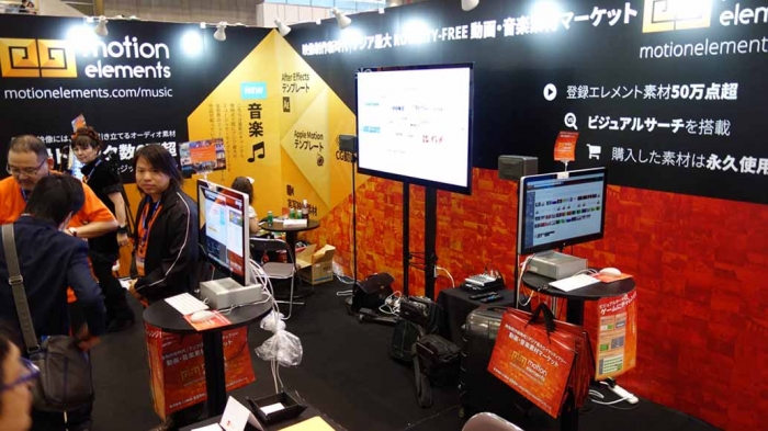 The MotionElements booth, with its striking orange and black design