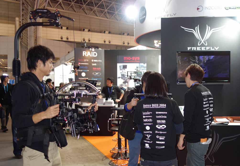 A presenter equipped with the camera gimbal system showed off its effectiveness by walking around the booth area.