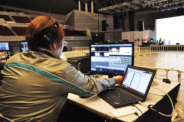 Technical director and head of Solutions Department 2 Hironori Yamazaki performing operations during rehearsal